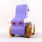 A handmade wooden toy car vintage style coupe painted nontoxic purple and white with spoked wheels finished with nonmarring amber shellac, from my  Bad Bob's Custom Motors Collection.