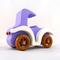 A handmade wooden toy car vintage style coupe painted nontoxic purple and white with spoked wheels finished with nonmarring amber shellac, from my  Bad Bob's Custom Motors Collection.