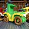 A handmade wooden toy car vintage style coupe painted nontoxic bright green and yellow with spoked wheels finished with nonmarring amber shellac, from my  Bad Bob's Custom Motors Collection.