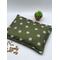 green fabric with daisies cherry pit heating pad