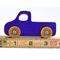 A handmade wooden toy pickup truck painted with bright blue and metallic sapphire blue paint. The wheels are finished with non-marring amber shellac. This toy is part of my Play Pal Collection.