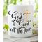 Picture of religious mug with the design that says God is good all the time and a gold cross.