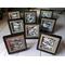 Photo of group of small framed rock drawings