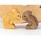 Handmade wooden puzzle featuring a family of koalas, including a mom and two joeys, that can be stacked or displayed freestanding as a toy animal.