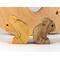 Handmade wooden puzzle featuring a family of koalas, including a mom and two joeys, that can be stacked or displayed freestanding as a toy animal.