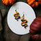 Orange and Black Resin Snake earrings. Completed with antique-gold finish hypoallergenic ear wires.