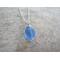 Light blue glass wire wrapped bead pendant on your choice of 20 or 22 inch sterling silver chain necklace.