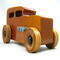 This handmade wooden toy car is based on a 1932 Ford Sedan Hot Rod. It is hand-finished with multiple coats of amber shellac and trimmed with black and grey acrylic paint.