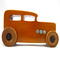 This handmade wooden toy car is based on a 1932 Ford Sedan Hot Rod. It is hand-finished with multiple coats of amber shellac and trimmed with black and grey acrylic paint.