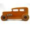 This handmade wooden toy car is based on a 1932 Ford Sedan Hot Rod. It is hand-finished with multiple coats of amber shellac and trimmed with black and grey acrylic paint.