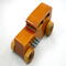 This handmade wooden toy car is based on a 1932 Ford Sedan Hot Rod. It is hand-finished with multiple coats of amber shellac and trimmed with black and grey acrylic paint.