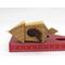 Handmade miniature birdhouse ornament crafted from select hardwoods, featuring a meticulous finish with a beeswax and oil blend—a collectible and charming decorative piece.