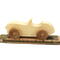 A handcrafted wooden toy convertible sports car, finished with a custom blend of oils and waxes, is the perfect gift for young children.