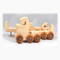 Handmade wooden toy truck play set includes three cars and a tractor-trailer finished with clear and amber shellac with metallic sapphire blue trim.