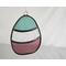 Stained glass Easter Egg on a neutral background, featuring pastel teal, clear, and plum stripes