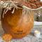 This image shows the back of the pumpkin decoration. The pumpkin's s name, Jack OLantern, is burned onto the back of the gourd shell.