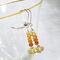 Stacked faceted citrine and gradated Hessonite garnet earrings with sterling silver accents and lever backs.