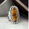 Sz 8.5 Orange Treasure Mountain Turquoise, large oval stone on tapered wide band fused, stamped lightly oxidized facing .75 right