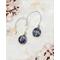 2 inch long earrings are comprised of rainbow flourite beads wrapped using Argentium silver on handmade earring wires.
