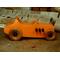 Handmade wooden toy car modeled after a 1927 T-Bucket hot rod. Finished with orange and black acrylic paint and amber shellac
