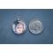 Charm next to a dime for size comparison on blue background.