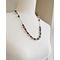 25 inch necklace features natural and earthy impression jasper beads with elegant red garnet bicone beads.