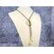 Peridot jasper donut pendant and teardrop tassels with bronze SilverSilk knitted wire chain.