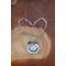 Silver chain link necklace featuring a white dog charm, Forever in my heart, and paw print acccent charms.