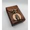 Premium Handmade Leather Tarot Card Case featuring a wise all-seeing owl patiently waiting on a branch in front of the full moon. This high quality leather case has a unique and interesting 3 color finish, with a natural tan moon set against a dark rich brown.