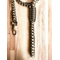 dark brown and camo paracord dog leash, 65", shown a light wood table