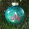 Teal Christmas Round 3" Ornament with a single silver initial in the center with a name decal layered on top in pink.  
