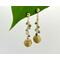 Green tourmaline gems and eco-friendly golden grass bead make these dangle earrings unique and elegant. 2 3/4 long, gold plated.