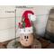 This is a handmade Christmas Santa Claus elf made with a real dried gourd. Including his elf hat, he is 12 inches tall and 4.5 inches wide. 