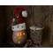This image shows Dingle the elf with a battery-operated candle lighting up his smile and snowflakes carved into the shell.