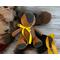 brown suede bear with fleece and yellow ribbon