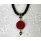 Black choker style necklace with red pendant