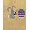 Easter Bunny Painting Egg on Butter colored towel Closeup