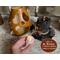 This handmade Halloween decoration comes with a battery-operated candle.