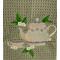 Tea Cup and Tea Pot on green mist towel