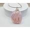 Pink glass pendant, 2 inches long, 1 inch wide, wrapped in silver wire hung on 24 inches of French Bullion stainless steel wire
