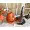 This is a Halloween pumpkin decorating an entryway table. The pumpkin has a witch hat that sits next to it.