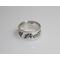 silver ring displaying the word death on it in black