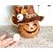 This image shows a Halloween witch decoration. It is made from a real dried gourd. It includes a battery-operated candle.