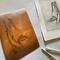 photo of hand-incised copper plate that was used for printing