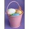 Pink metal pail with eggs.