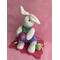 Measurements: Bunny 9" tall  x 4" wide - Plaque 7.5" length x 5" wide. Cute sock bunny seated on a decorative pink base adorned with Easter eggs and hold a large glitter eg.  Wonderful Bunny for a centerpiece for the special holiday