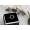 Sterling silver ring with an open circle top.
