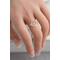 Sterling silver ring with an open circle top modeled on a women's hand.