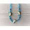 Cloisonne golden fish and frosted aqua beaded necklace
