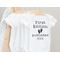 white baby bodysuit with first edition published 2024(or year of baby birth)font typewriter in black and little baby feet added for cuteness